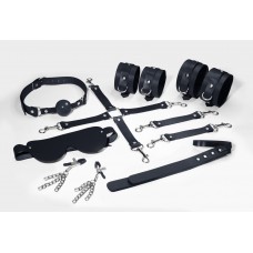 Набір Feral Feelings BDSM Kit 7 Black, наручники, поножі, конектор, маска, паддл, кляп, затискачі